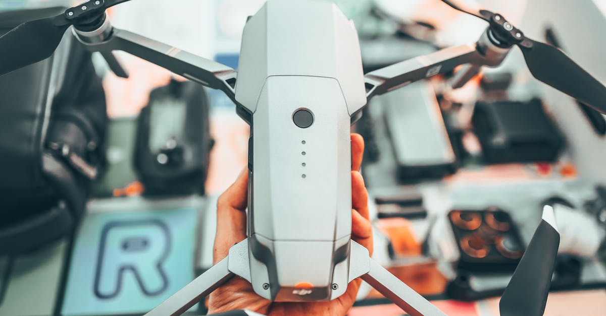 What powerbank can I use on the flight? - Crop faceless person holding modern drone