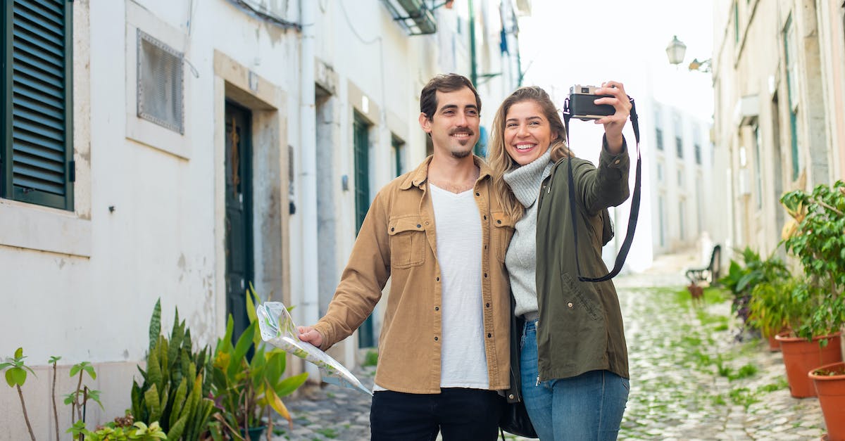 What precautions should travelers take in Spain/France? - A Couple Having a Selfie