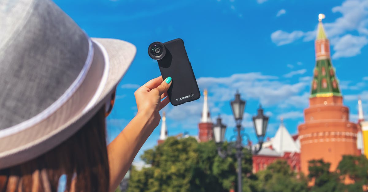 What ride-hailing companies operate in Moscow as of 8/2019? [closed] - Woman Holding Phone With Camera Lens While Pointing It to the Sky