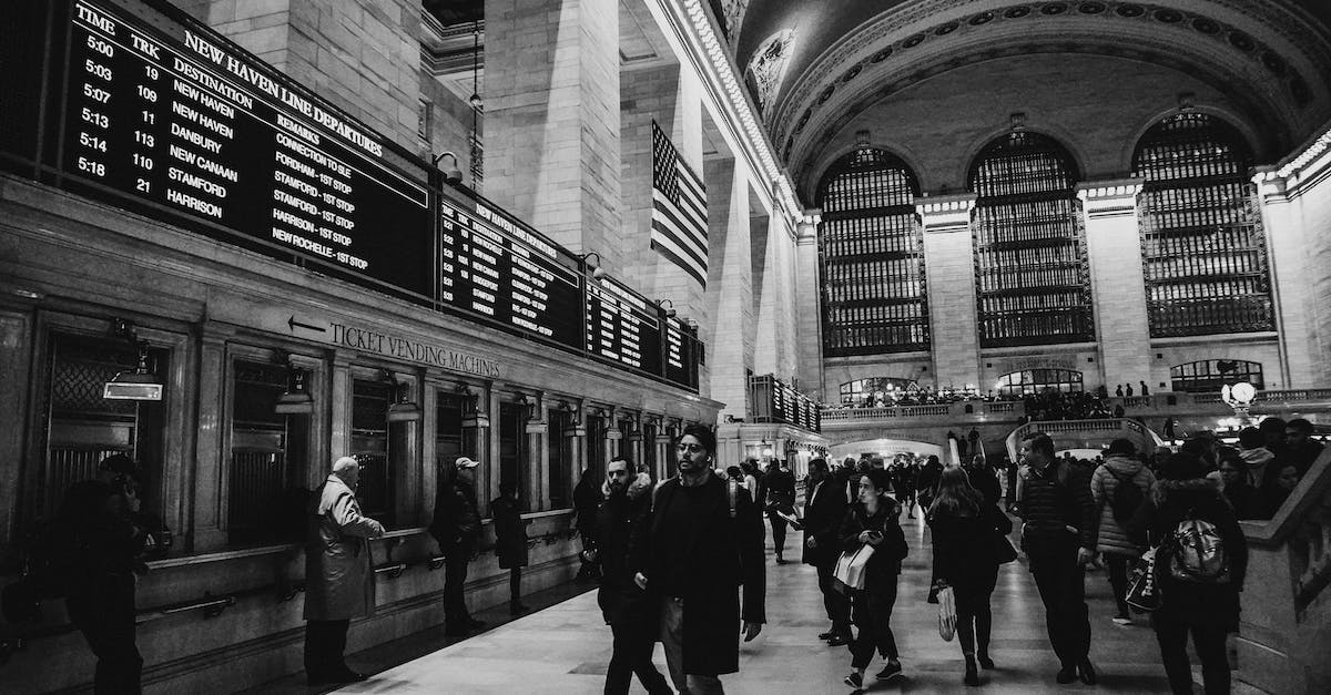 What rights do passengers have when flights in the USA are delayed? - Grayscale Photo of People inside Grand Central Terminal