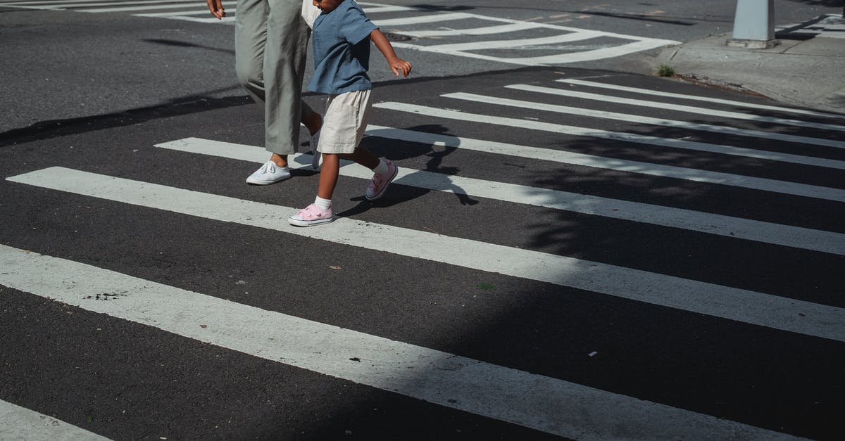 What routes are there to cross the Pacific East-to-West (without flying)? - Crop mother and daughter crossing road