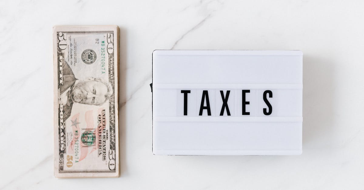 What rules govern forced removal from flights (due to overbooking)? - American dollar bills and vintage light box with inscription