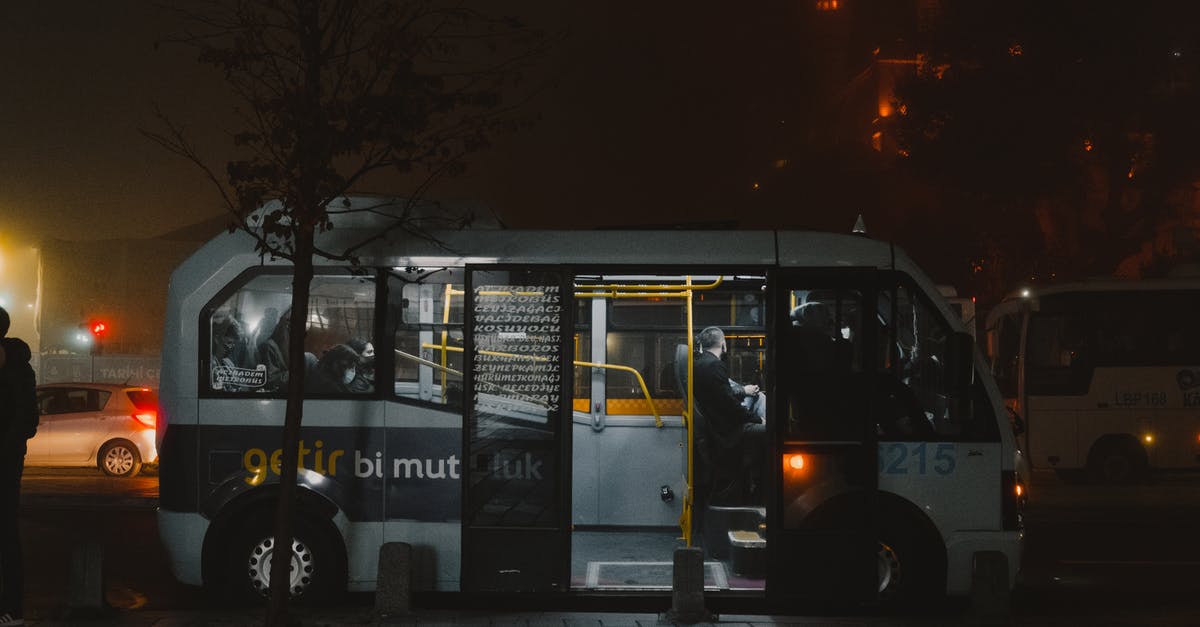 What time does the Tbilisi to Istanbul bus depart? - White and Black Bus on the Road During Night Time