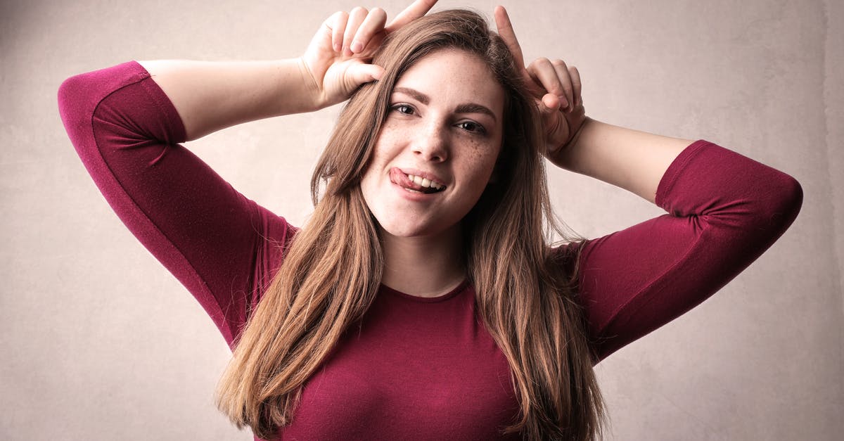 What to do with long facial hair in the onsen? - Woman in Red Long Sleeve Shirt Making a Funny Face