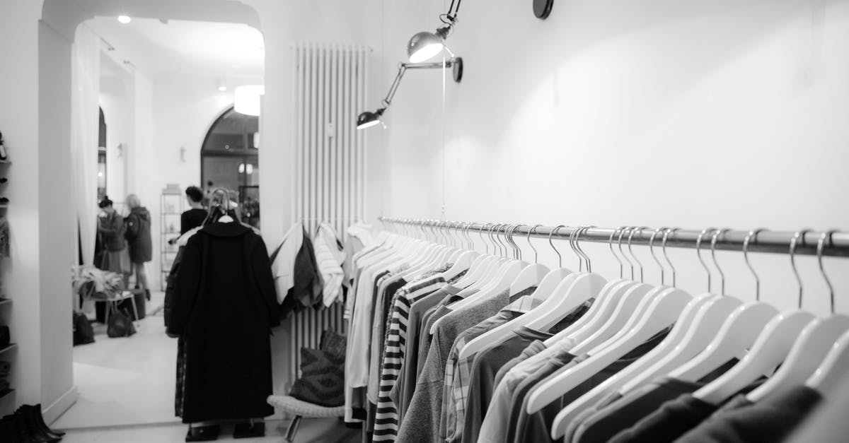 What to wear in Amsterdam in end of June [duplicate] - Grayscale Photography of Clothes Lot