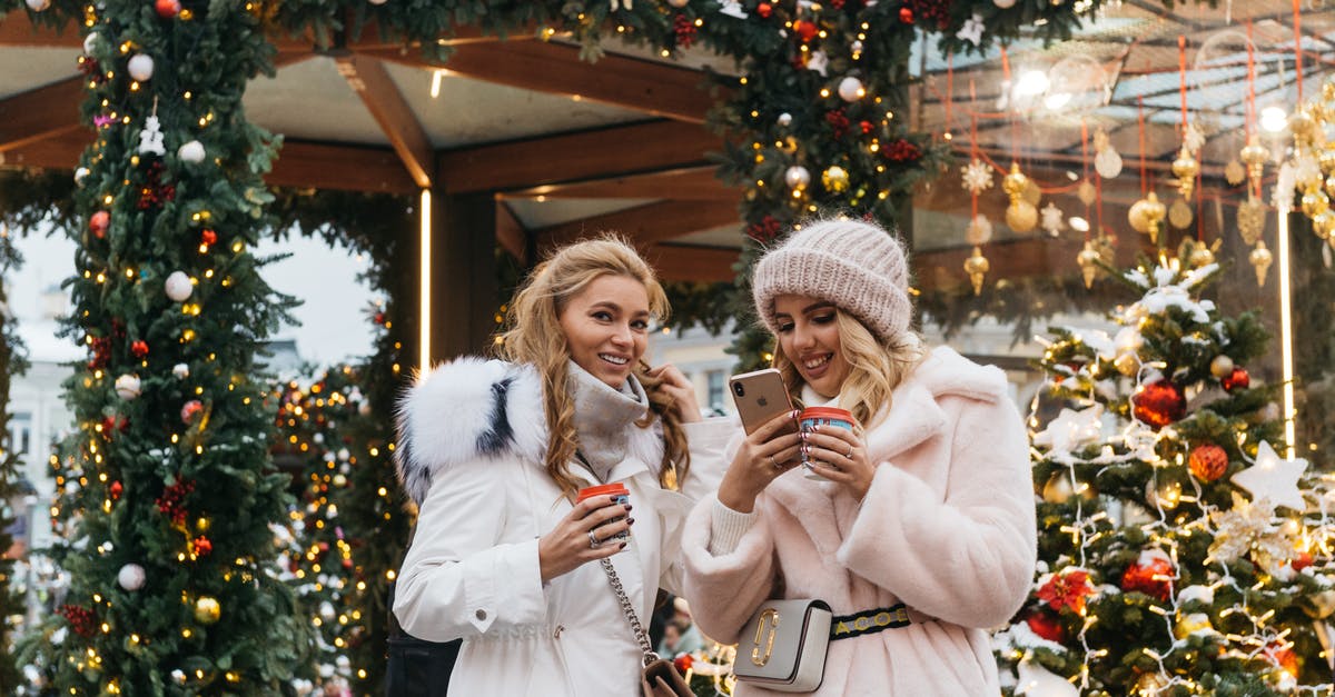 What to wear in Russia - Two Women Near Christmas Decorations