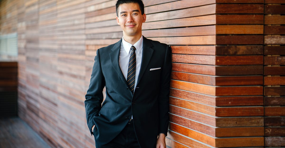 What to wear in Switzerland in July? - Man Wearing Black Suit Jacket and Pants