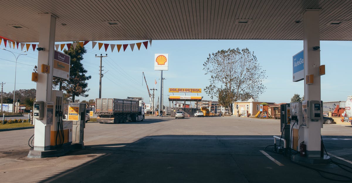 What’s the cost of Road tolls Calais to Copenhagenby car? [closed] - Empty gas station with oil petrol dispensers located on highway for serving long distance vehicles