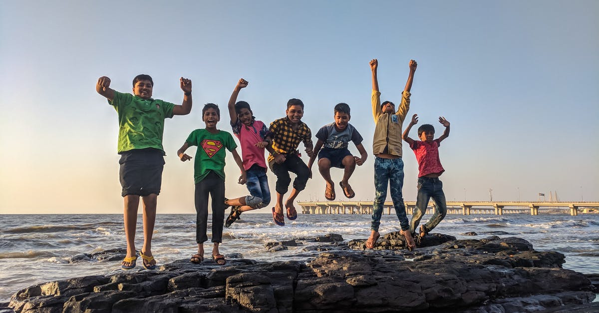 When applying for 60 day tourist visa via Thailand embassy in UK do I need to pay for children under 14? - Boy Wearing Green Crew-neck Shirt Jumping from Black Stone on Seashore