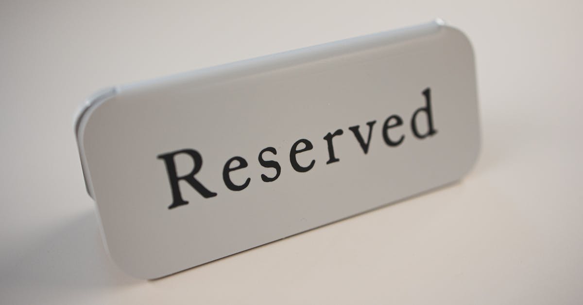 When does Amtrak assign reserved seats? - Metal signage with black letters saying Reserved on gray background used in cafes and restaurants