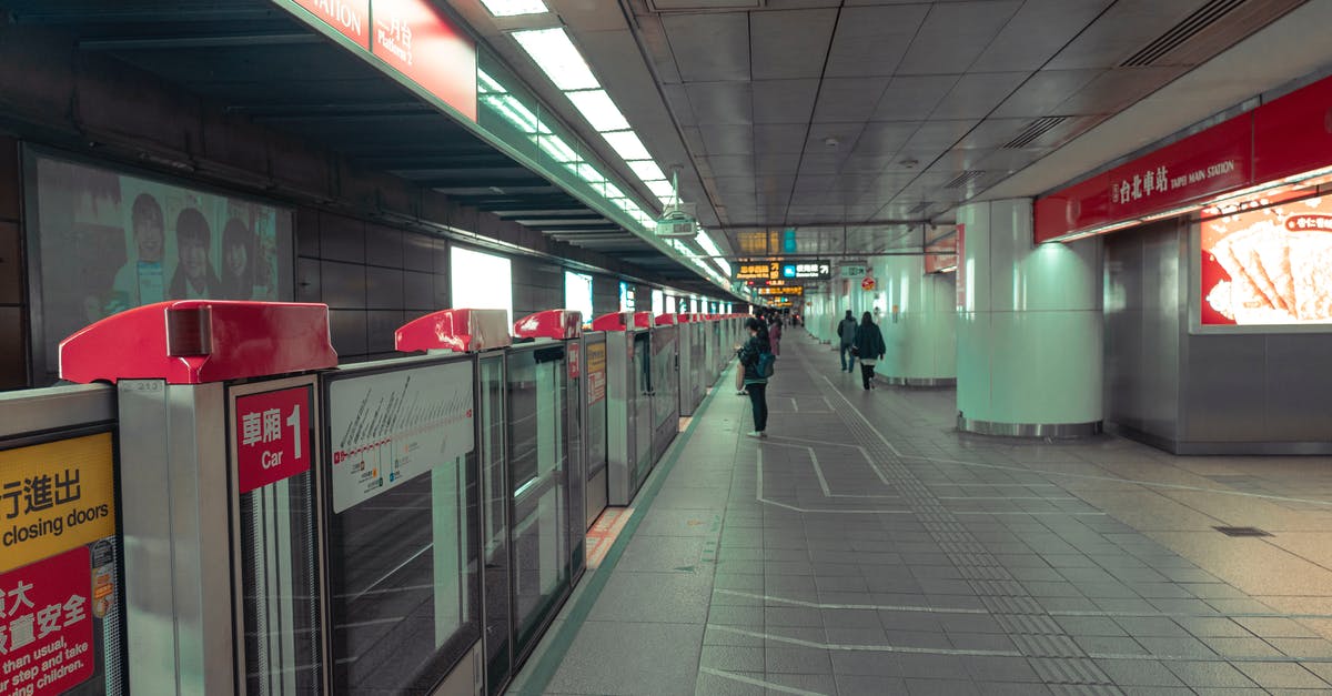 When does rescheduling a train count as a delay? - People Walking on Hallway