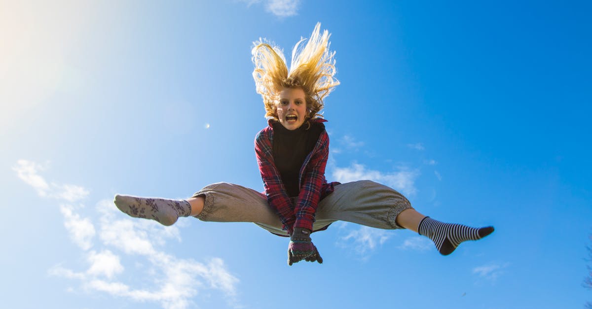 When flying Singapore->Kuala Lumpur->Penang, where is immigration cleared? - Woman Jumping Under Blue Sky