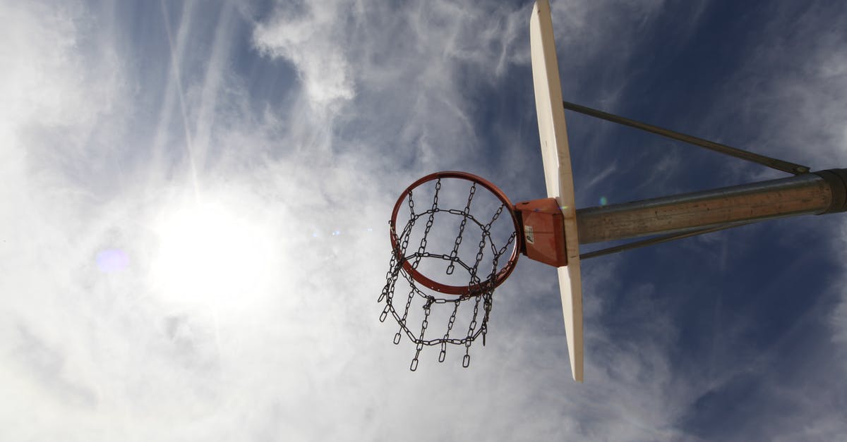 When to arrive for a NBA game? - Low-angle Photography of Red and White Basketball System