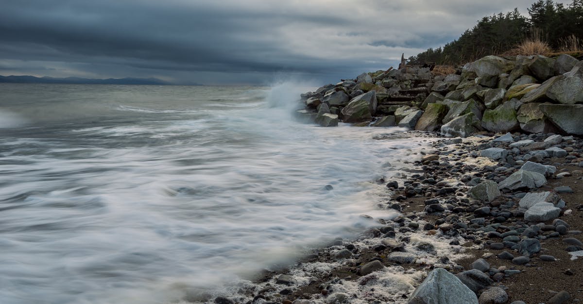 Where's this in Writing-on-Stone Provincial Park, AB? - Rocky Shore Under Cloudy Sky