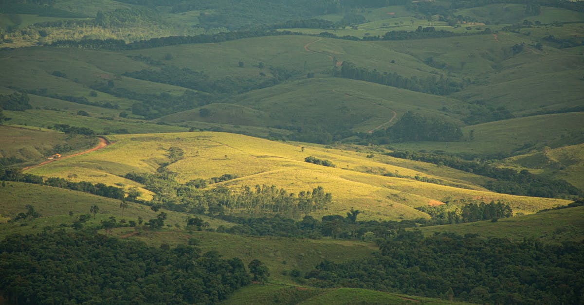 Where's this swanky house and vineyard near a mountain? - Aerial Photography of Green Mountains