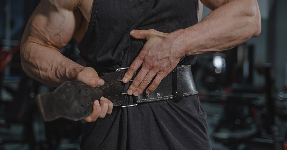 Where are belt 1, 2, ... in Brussels airport? [closed] - Man in Black Tank Top Putting Weightlifting Belt