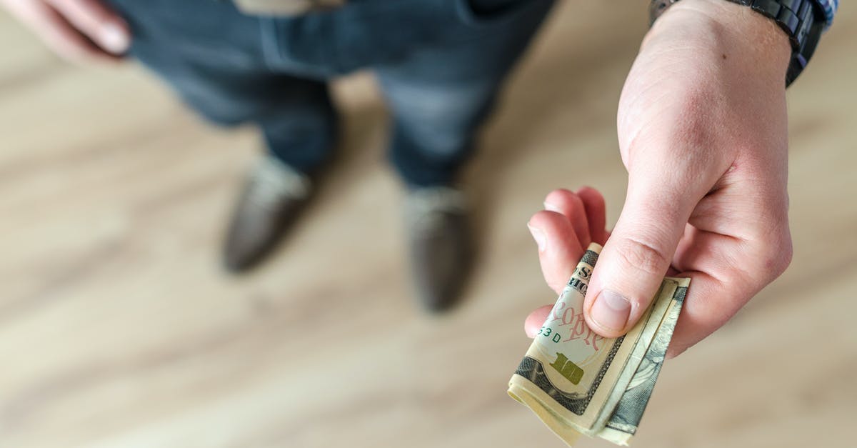 Where are belt 1, 2, ... in Brussels airport? [closed] - Person Holding Banknote