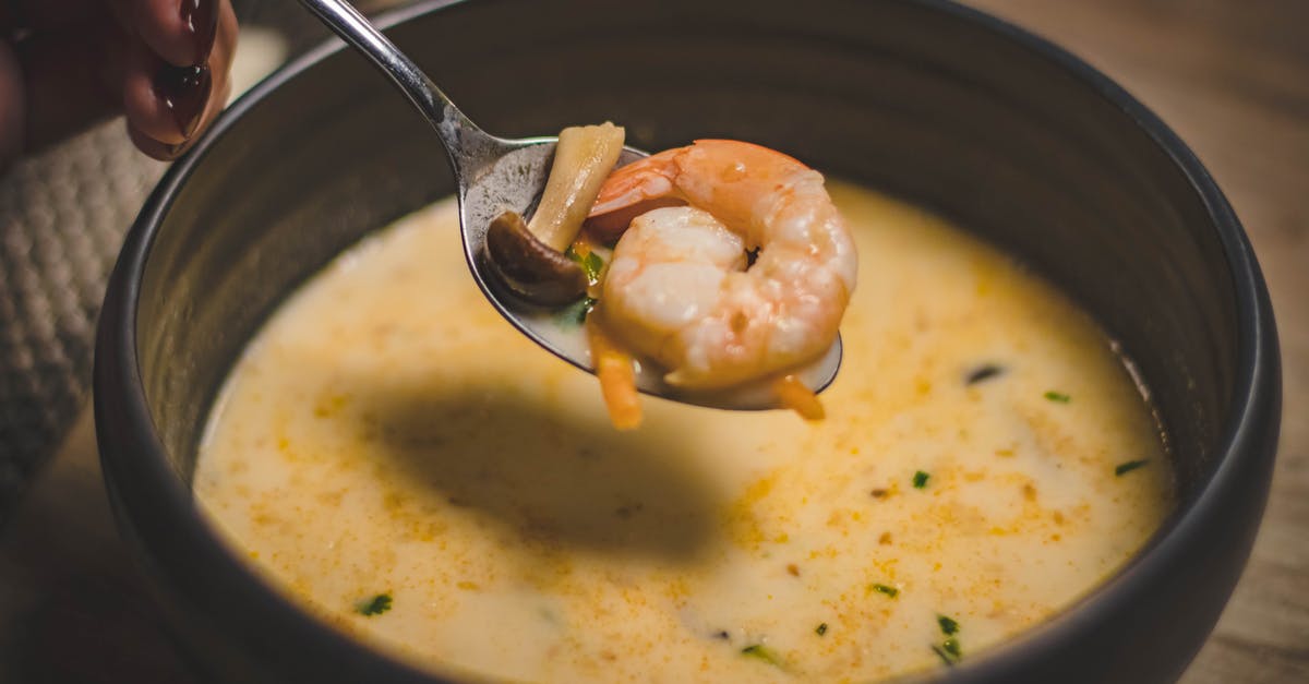 Where can I eat turtle excrement soup? - Bowl of Shrimp Soup on Brown Wooden Surface