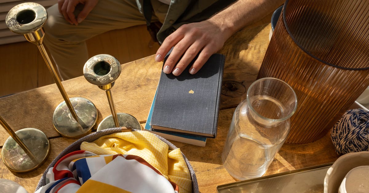 Where can I exchange Paraguayan Guaranies in Santiago, Chile? - Books and Glass Items on Wooden Table Top 