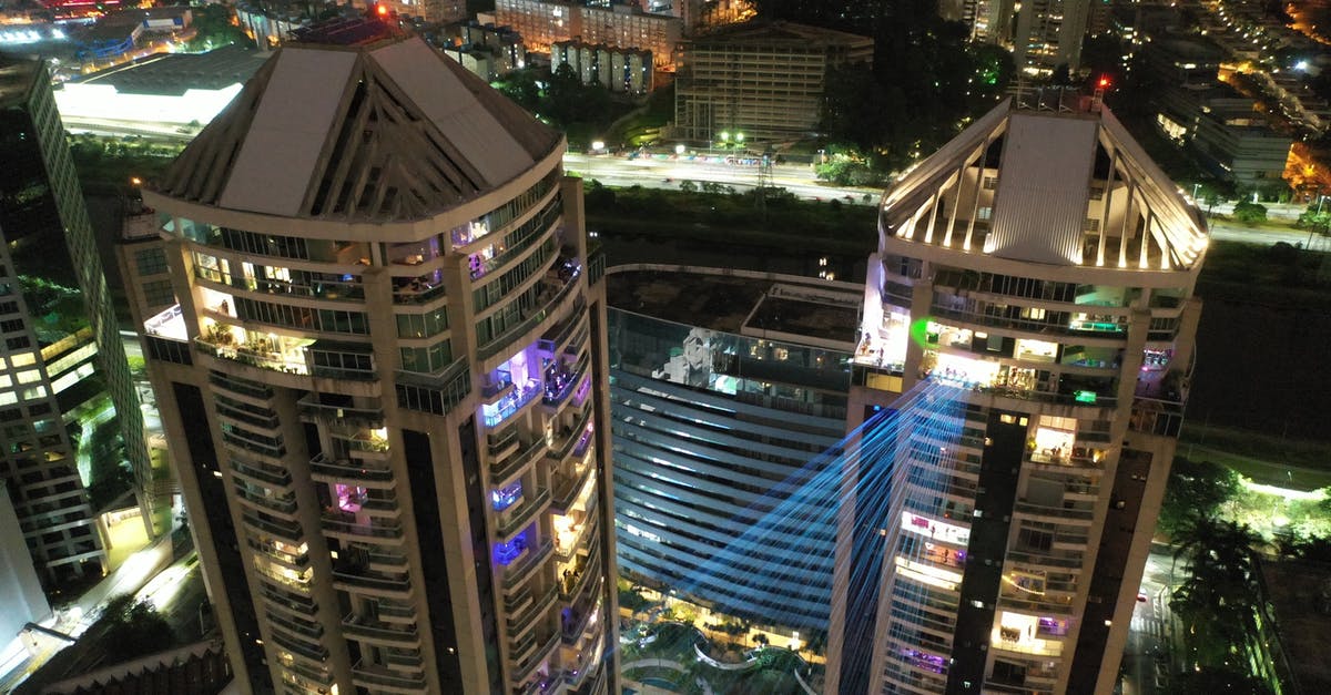 Where can I find high, unobstructed night time views of Tokyo? - From above of illuminated facades of modern district with high buildings at night time