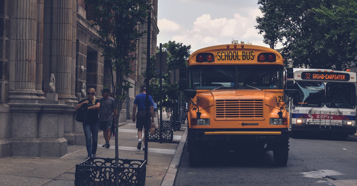 Where can I find maps of buses / bus routes in Muscat? - Yellow School Bus Beside Gray Concrete Building