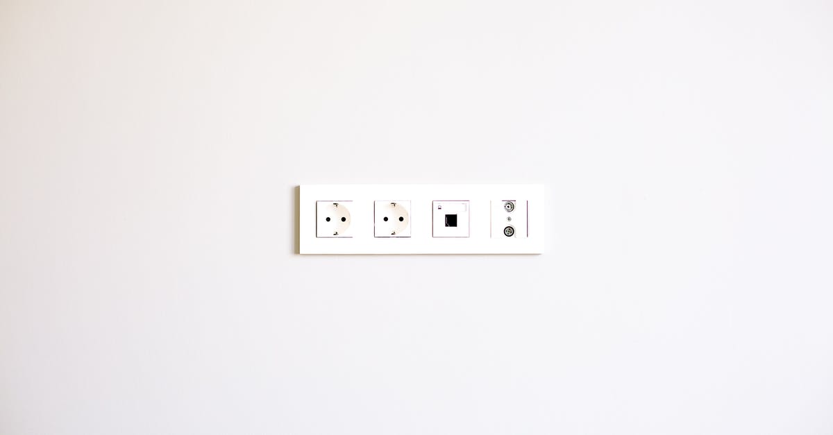 Where can I find plug sockets in Riga Airport (RIX)? - Photo of Wall Socket