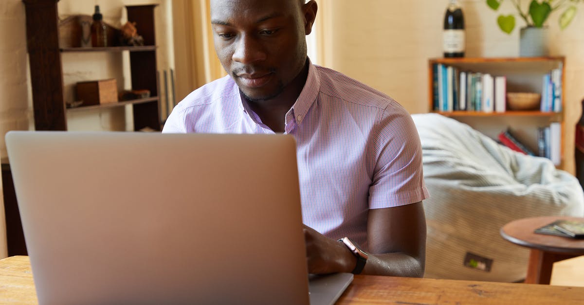 Where can I get Heathrow Airport passenger check-in times data and/or lounge entry data? - Concentrated African American male typing information on netbook at wooden table in cozy living room Where can I get Heathrow Airport passenger check-in times data and/or lounge entry data? - Concentrated African American male typing information on netbook at wooden table in cozy living room