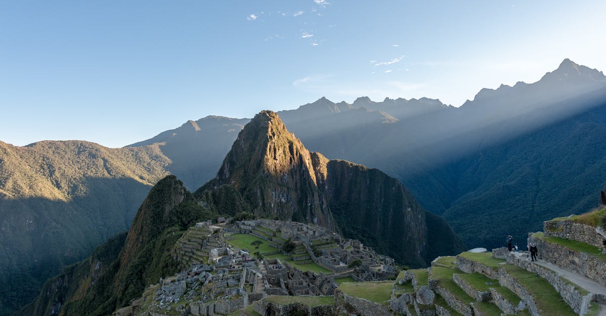 Where can I get the required permits for Machu Picchu and Huayna Picchu? - Green and Brown Mountains