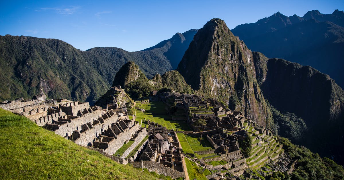 Where can I get the required permits for Machu Picchu and Huayna Picchu? - Mountain Machu Picchu under Blue Sky 