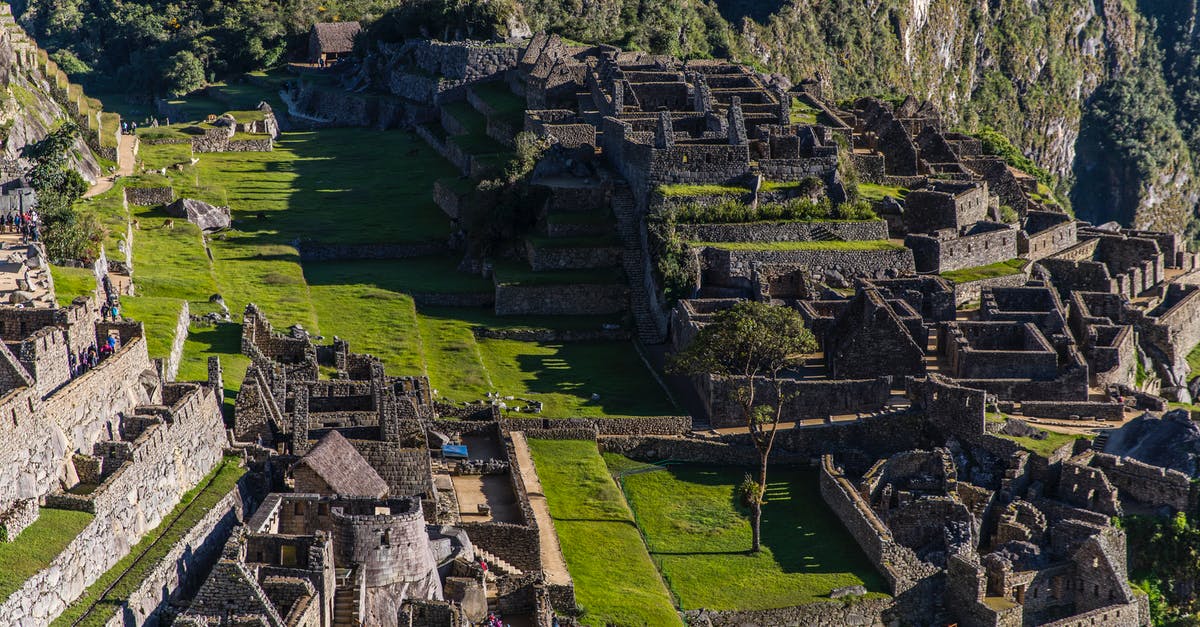 Where can I get the required permits for Machu Picchu and Huayna Picchu? - Machu Picchu during Daytime 