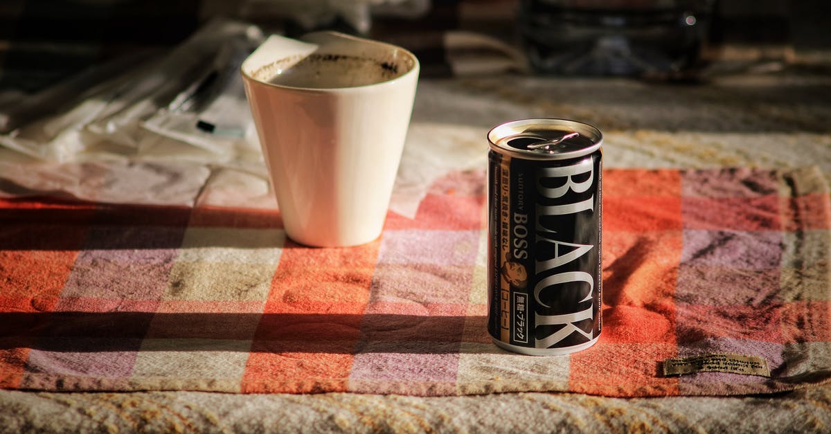 Where can I go by boat from Amsterdam? [closed] - Black Boss Can on Top Beside White Mug