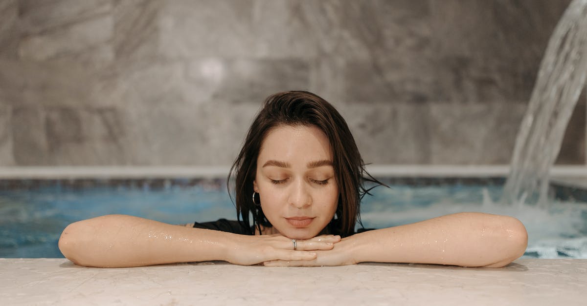 Where can I have a hammam (Turkish bath)? - A Woman with Her Eyes Closed while in a Pool