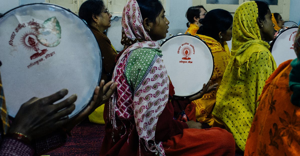 Where can I listen to authentic Fado in Lisbon? - Group of Indian women with tambourines