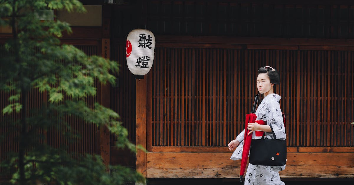 Where can I photograph fake geisha in Kyoto? - A Woman Walking on the Street