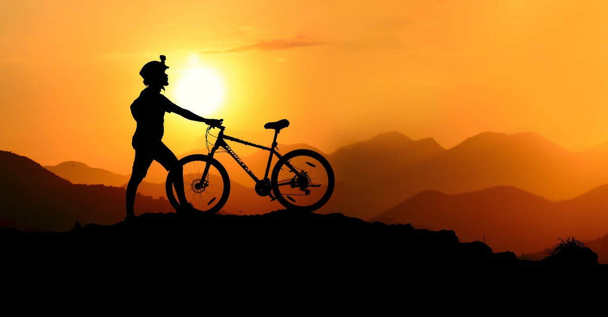 Where can I rent a decent mountain bike in Zürich? - Silhouette Photography of Biker on Top of Hill