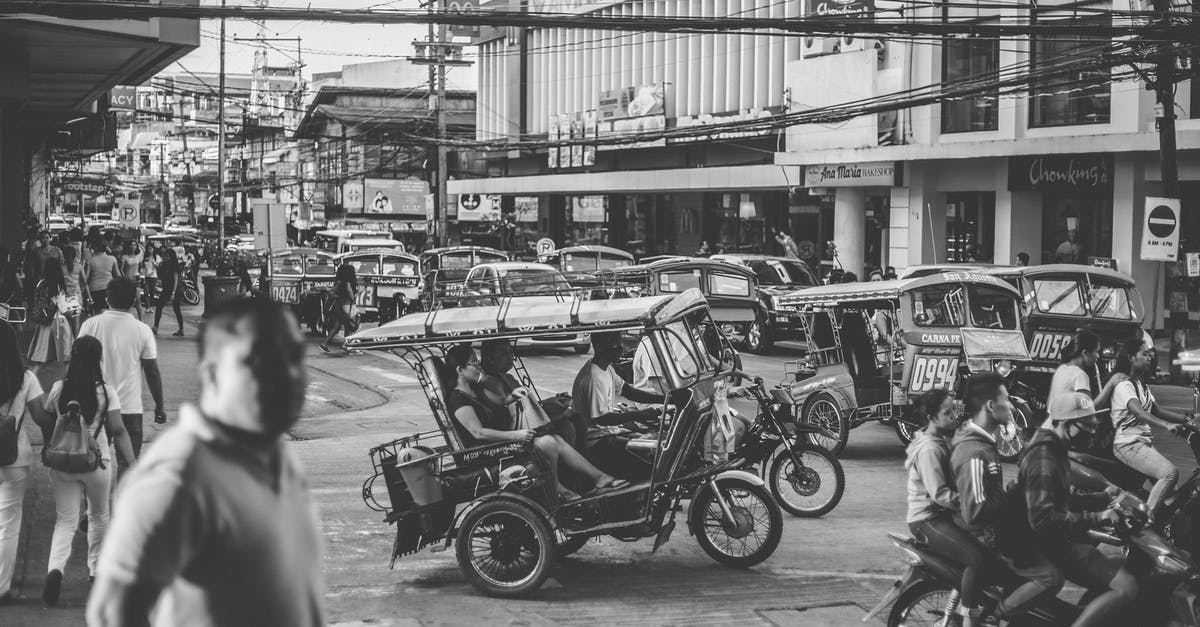 Where can I rent a motorbike in the Philippines? - Grayscale Photo of Motorcycles and People