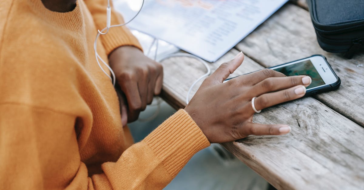 where can I send free sms to hong kong [closed] - Black woman touching screen of smartphone at table