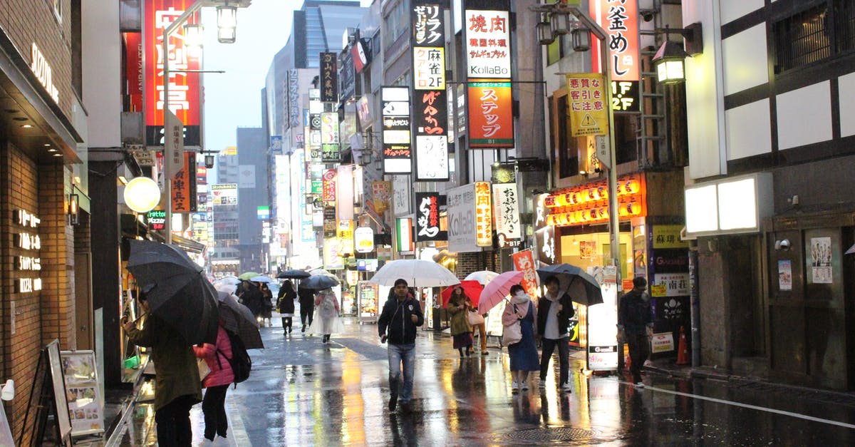 Where can one buy anti-UV umbrellas in Santiago, Chile? - People Walking on Street