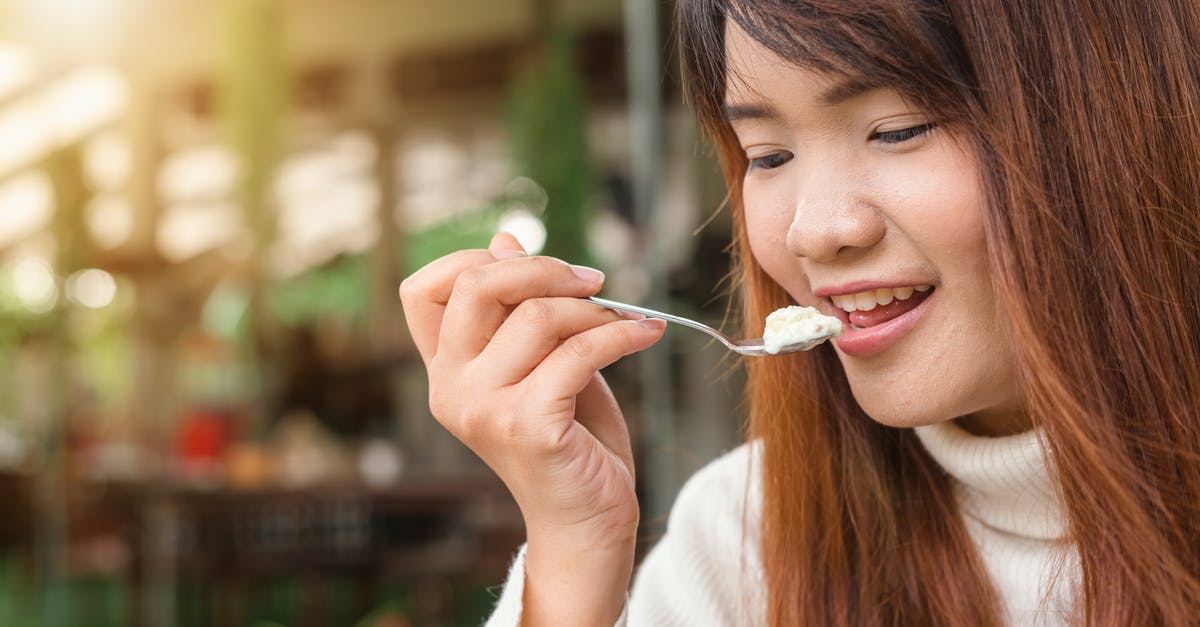 Where can people allergic to dairy eat when travelling in France? - Woman Holding Spoon Trying to Eat White Food