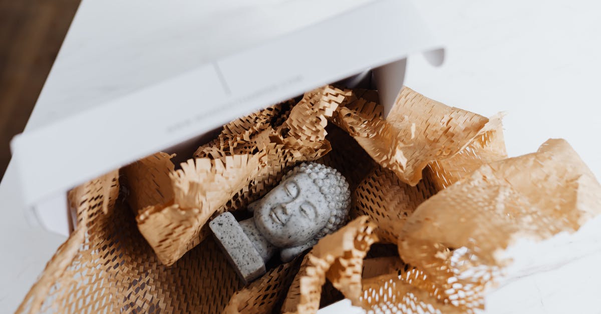Where can you safely store your belongings in order to travel? [closed] - Granite Buddha bust in cardboard package