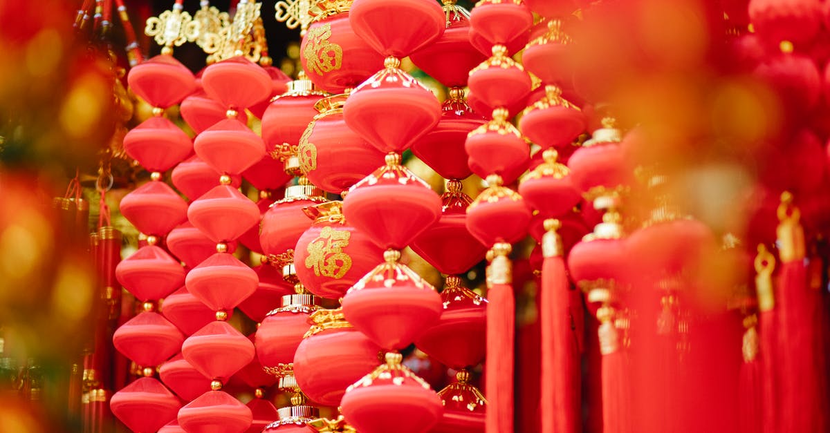 Where in Sweden can I celebrate midsommar with the locals? - Red and golden Asian decorations hanging in local market