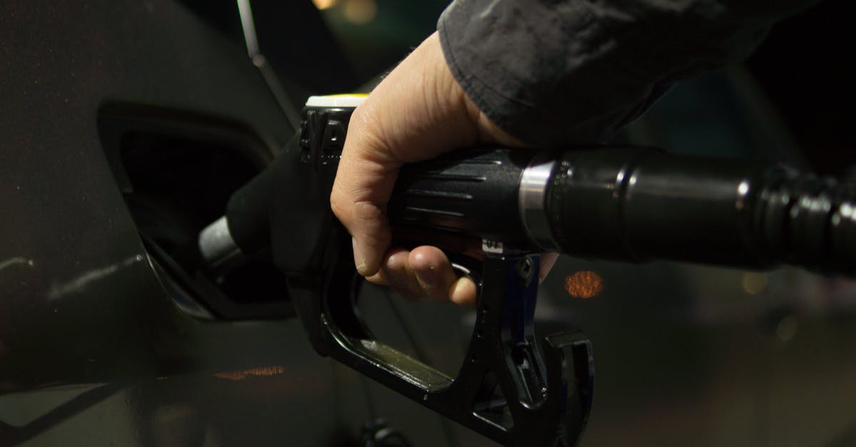 Where in Switzerland can you refill a gas cylinder? - Person Holding Gasoline Nozzle