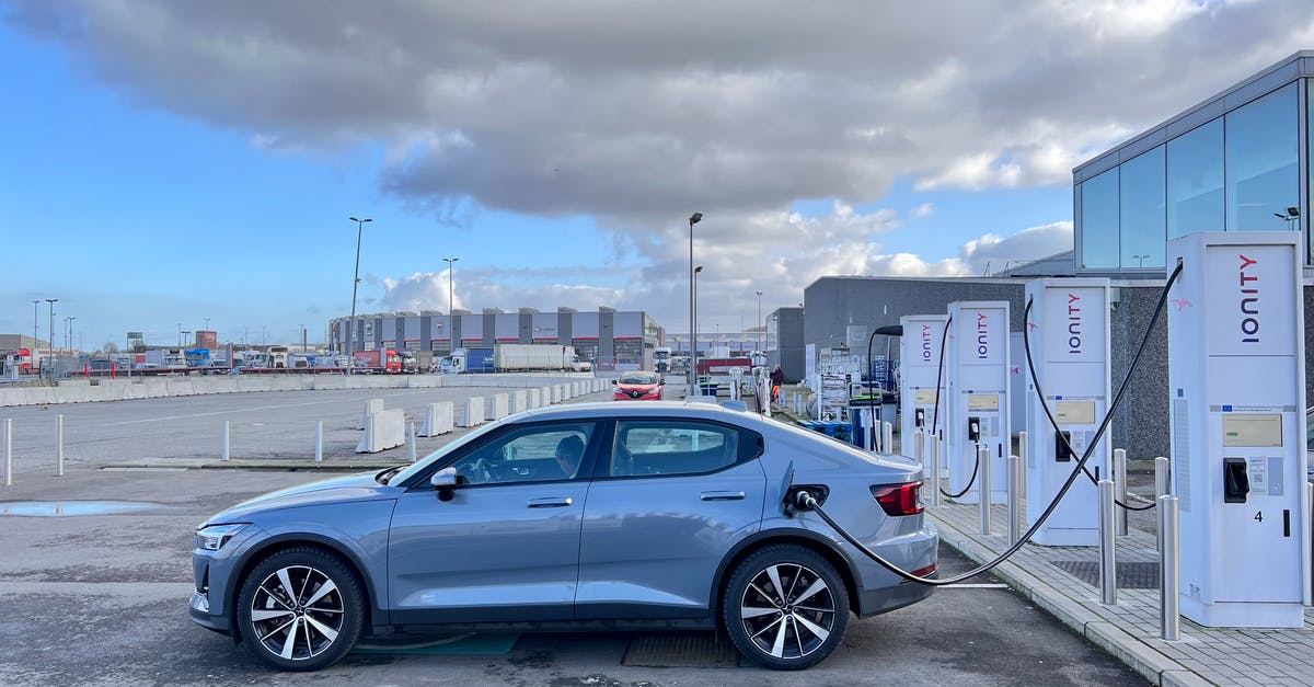 Where in Switzerland can you refill a gas cylinder? - Blue Sedan Parked on Gray Concrete Road