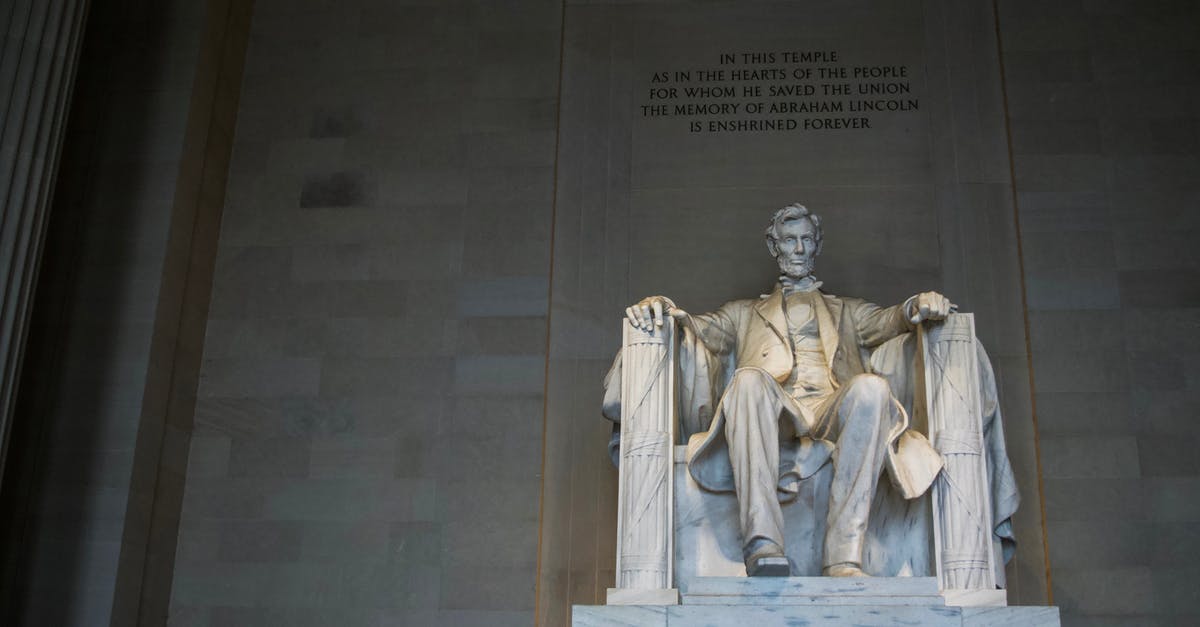 Where in the US is this statue located? [closed] - From below of marble statue of American president sitting on chair near wall with inscription located in Washington DC