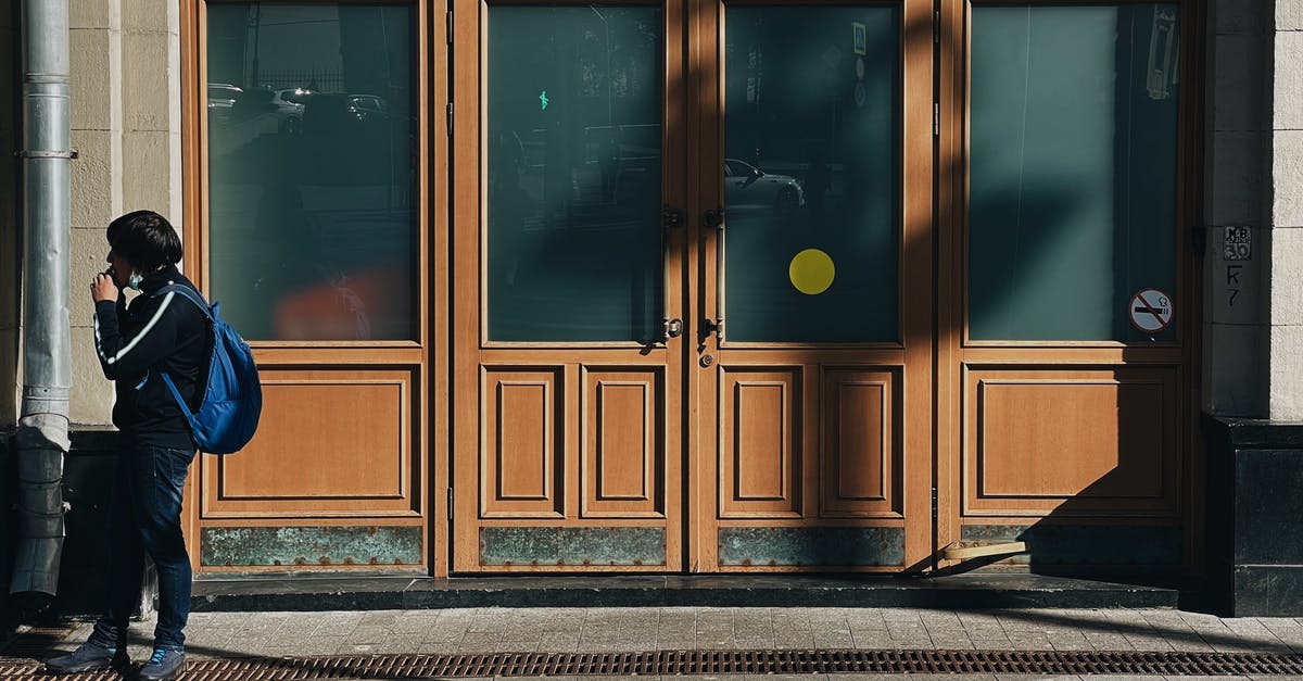 Where is the actual entrance to Zagreb airport (Zračna luka Franjo Tuđman)? - Brown Wooden Door With Glass Panel