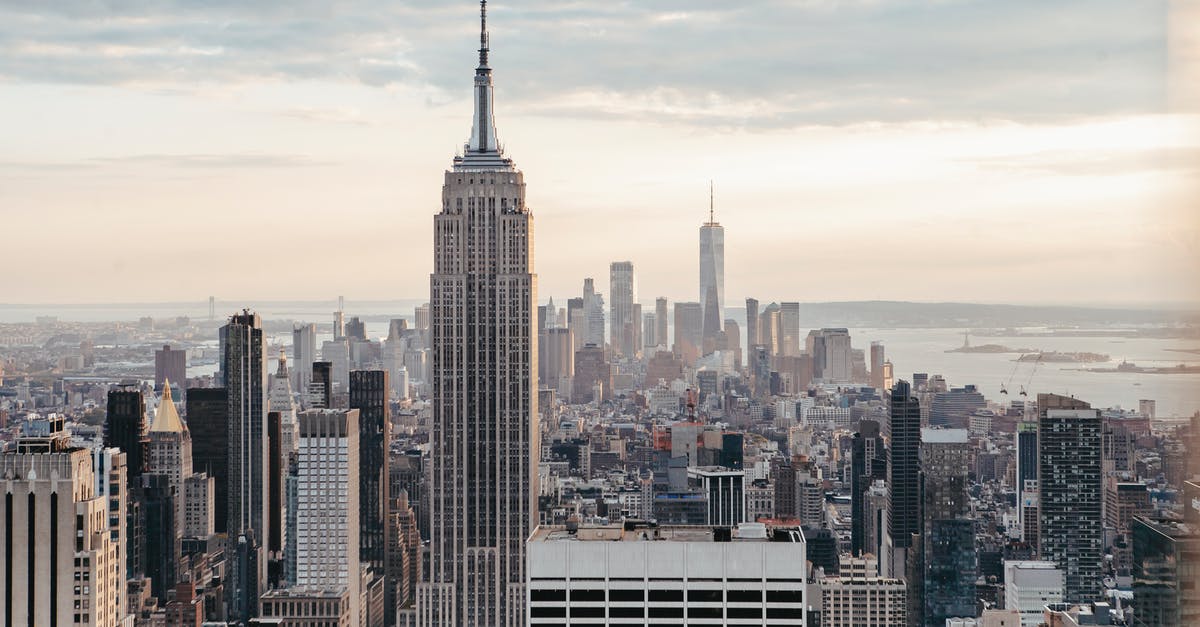 Where is the Hanuatu Island complex? - Empire State Building near multistage houses against ocean