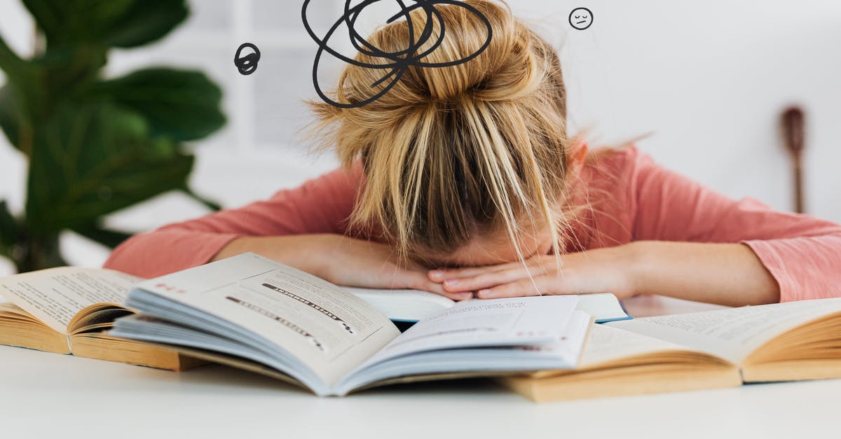 Where is the shown sleeping area at Schiphol airport? - Woman Putting Her Head Down on the Desk