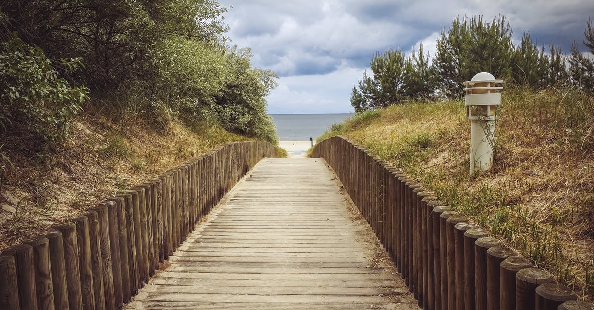 Where is this fence boardwalk located in Victoria, BC? - Brown Pathway Near Bollard