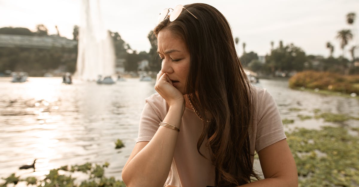 Where is this fountain (from Counter-Strike)? - Woman in White T-shirt Sitting on White Flower Field