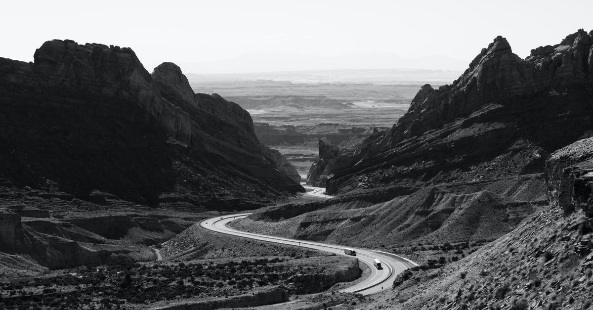 Where is this on highway 24/highway 12 in Utah? - Grayscale Photo of Roadway Surrounded With Rocky Mountains